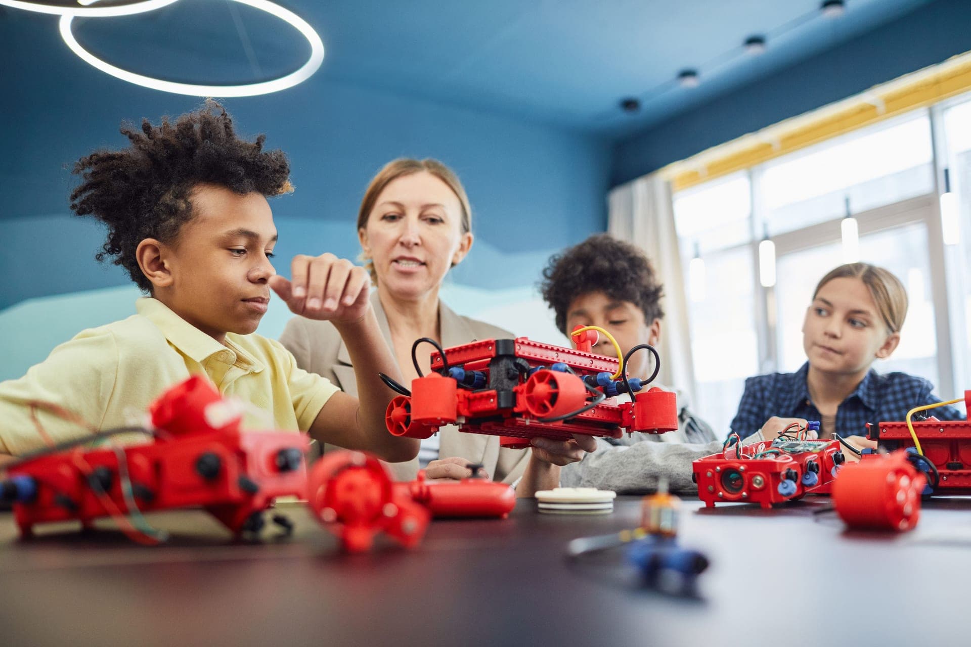 Two children working together on a robot project