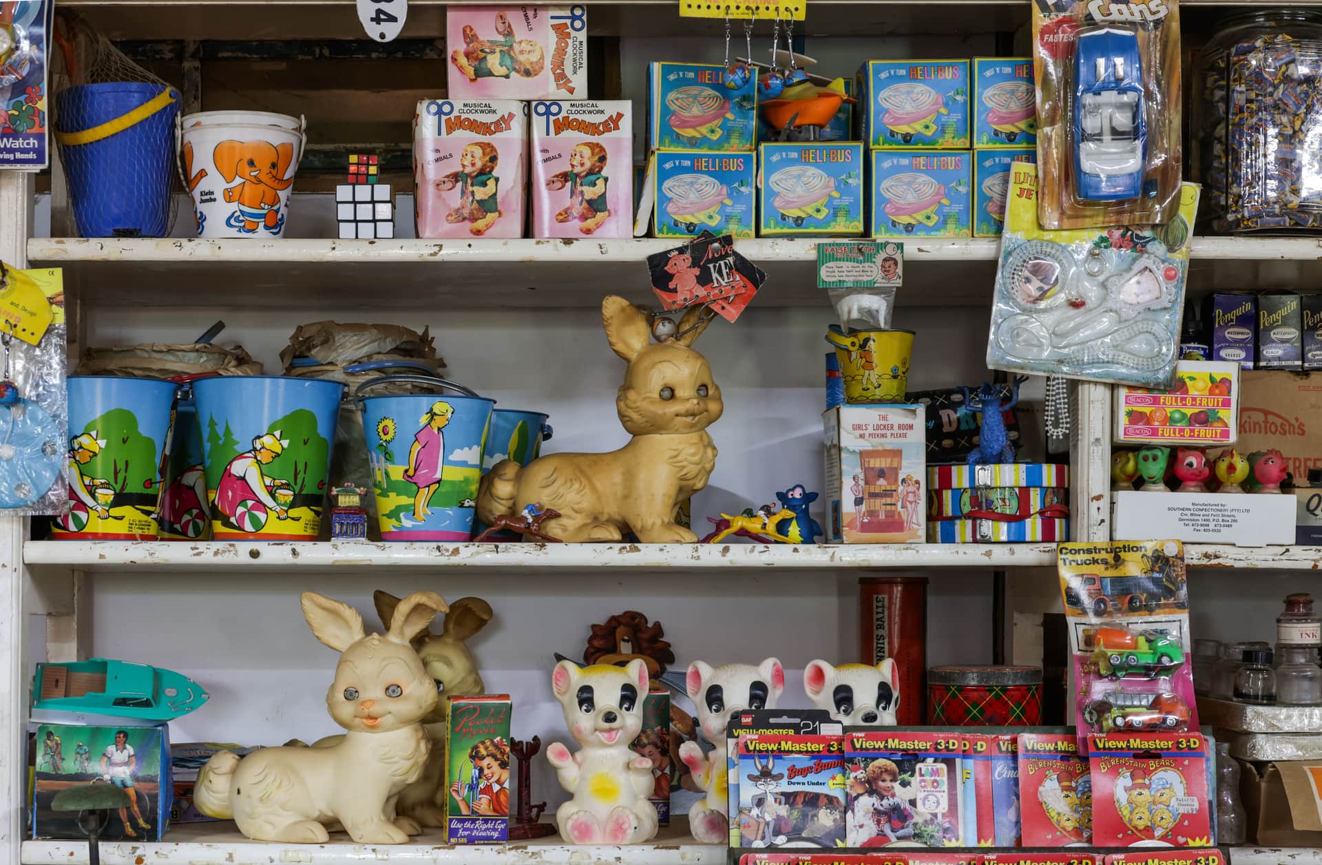 A shelf of colorful boxed toys in a shop