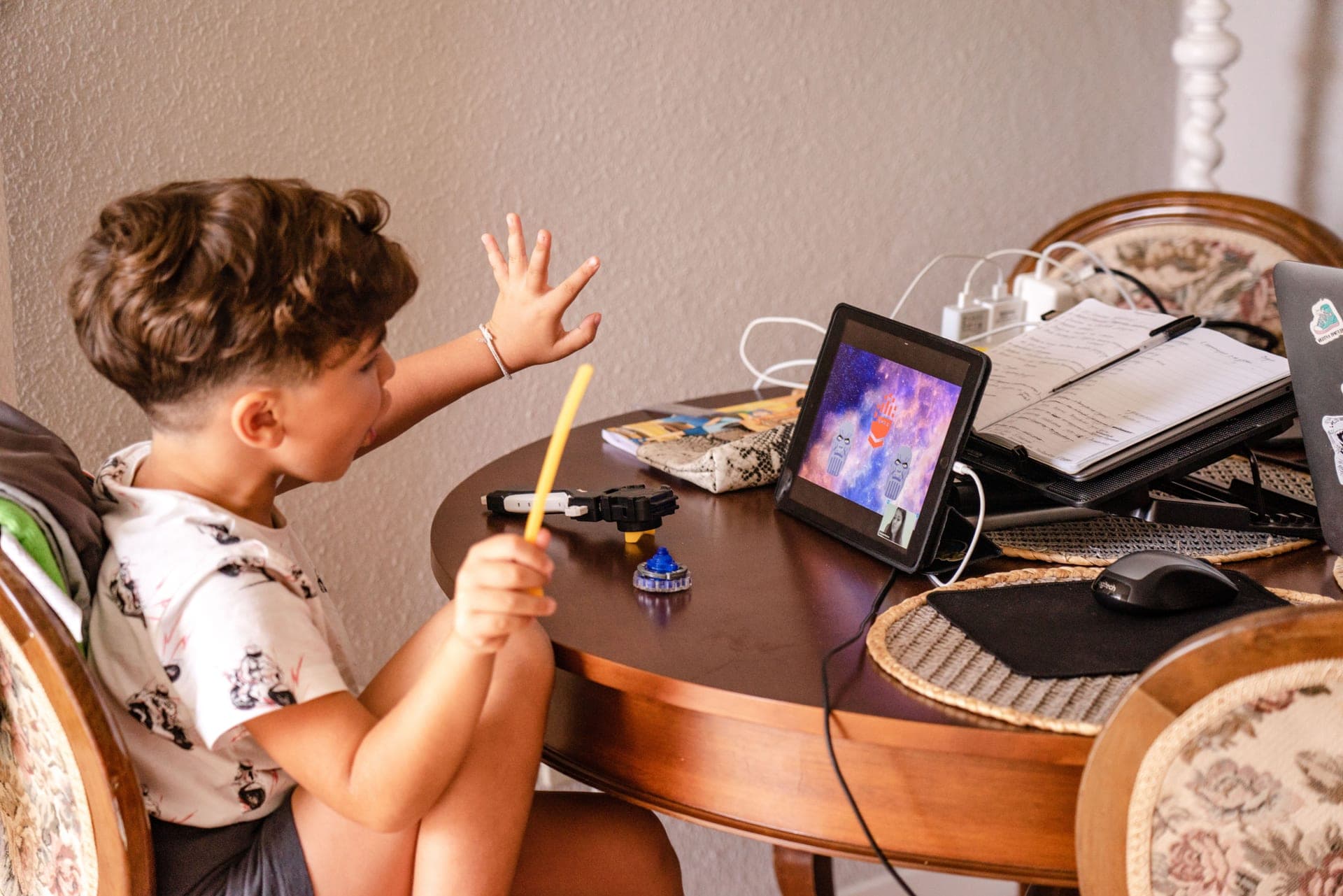 A child choosing a toy instead of a tablet