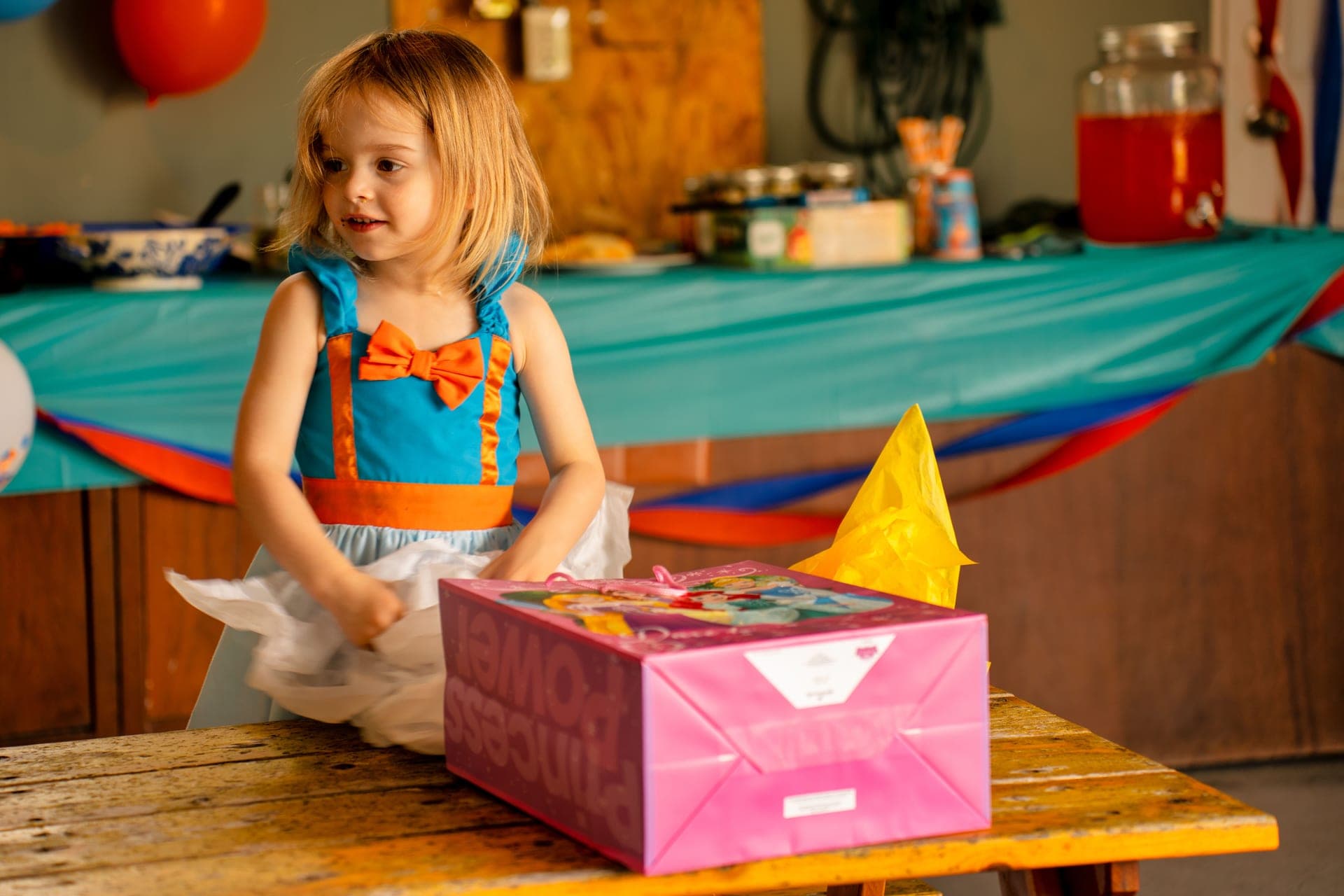 A child opening a present excitedly