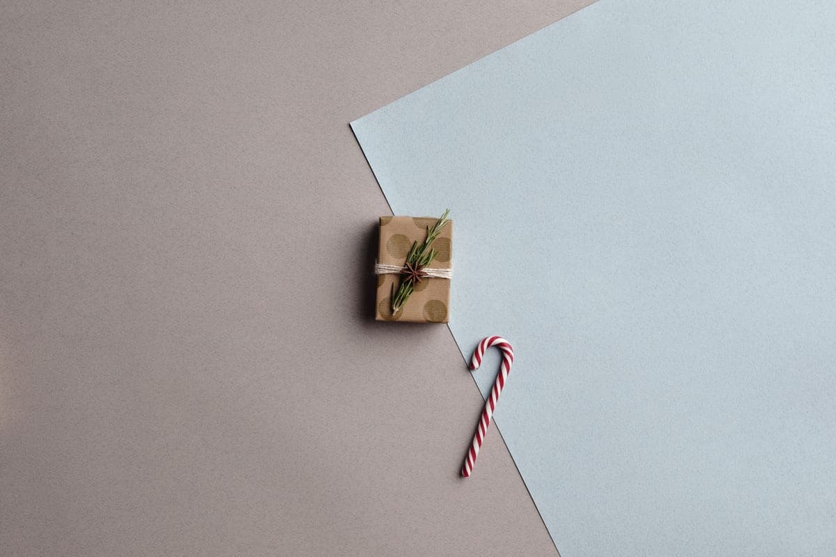 Small pastel wrapped gifts on a light background
