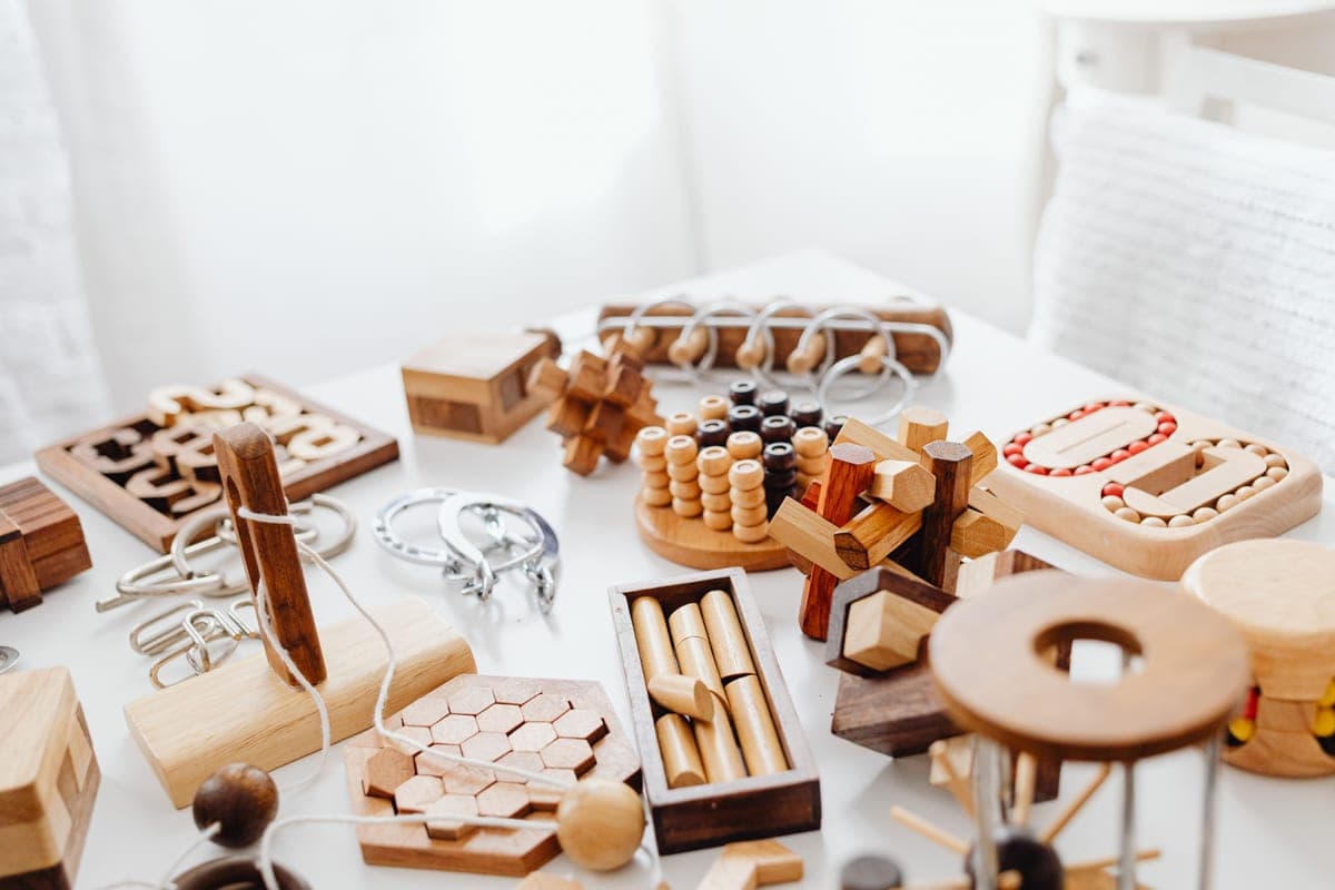 A wooden brain teaser puzzle on a table
