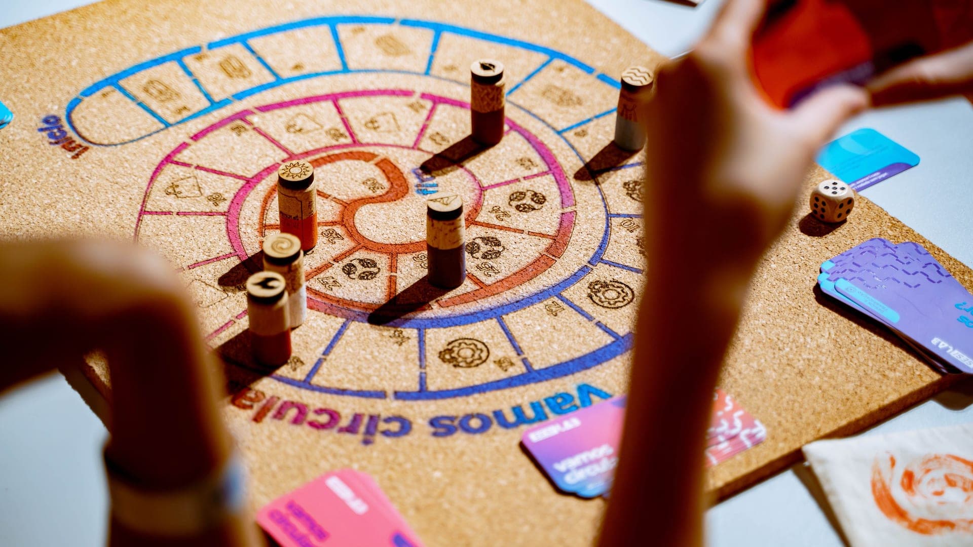 Players around a colorful board game