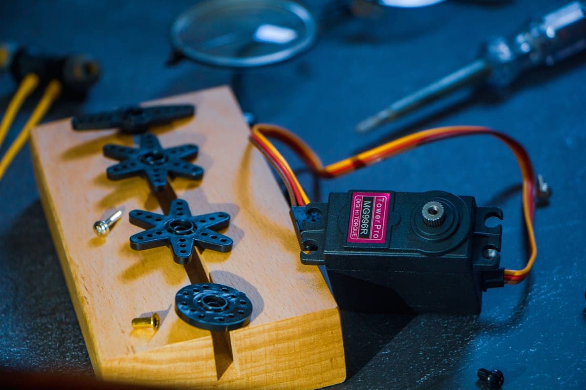 Robotics kit parts and gears laid out on a table