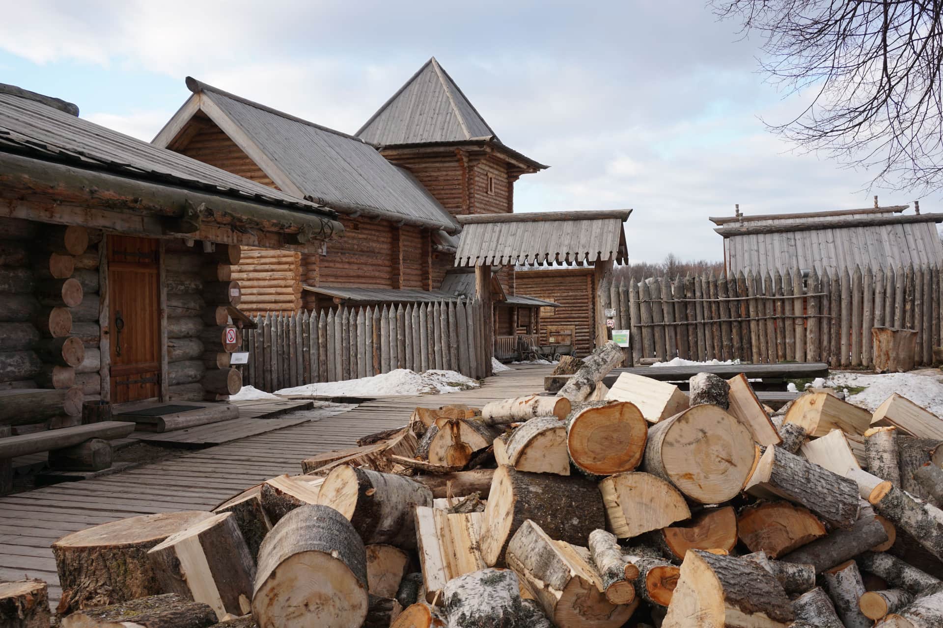 A wooden log cabin toy under construction