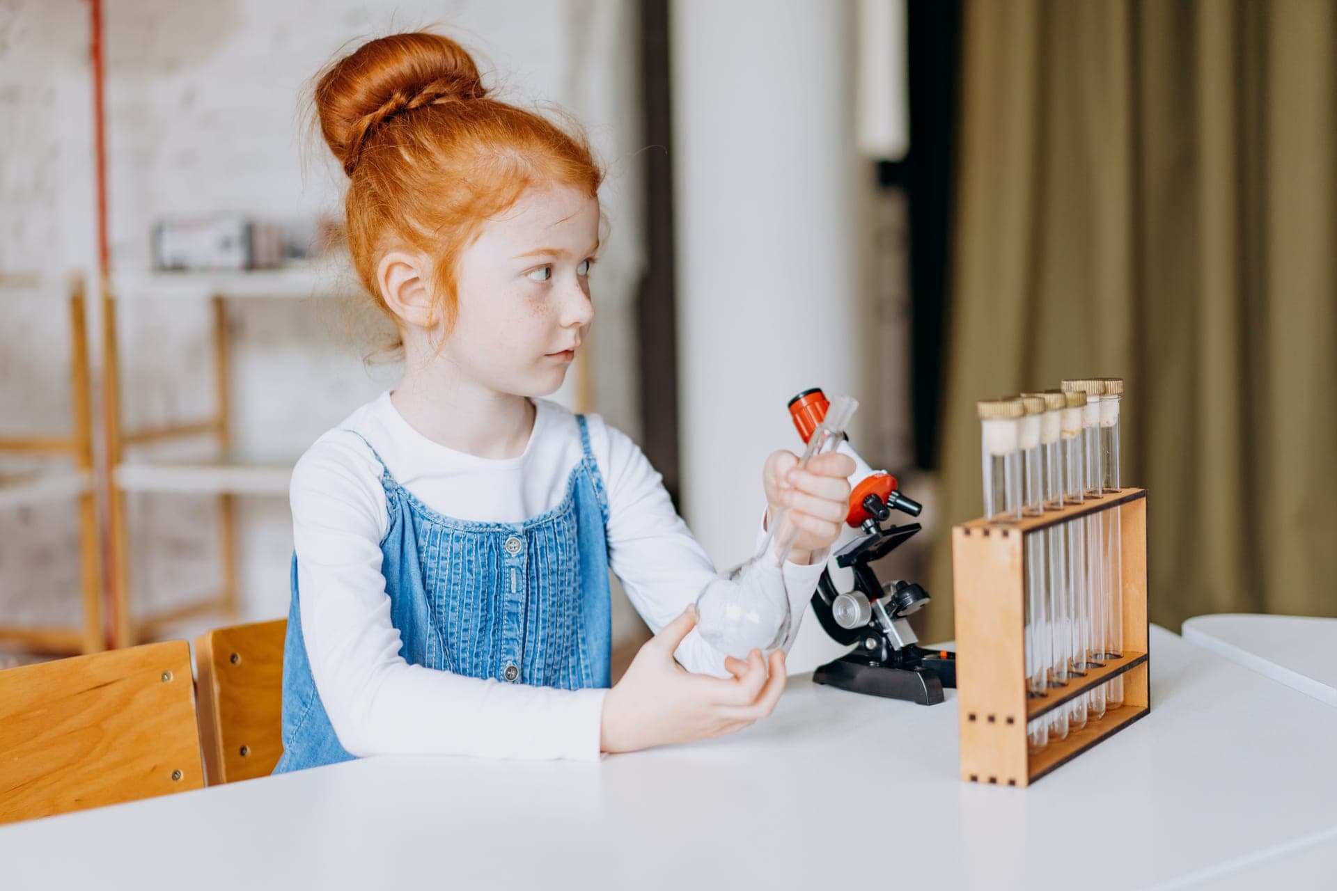 A child doing a science activity alone at a table