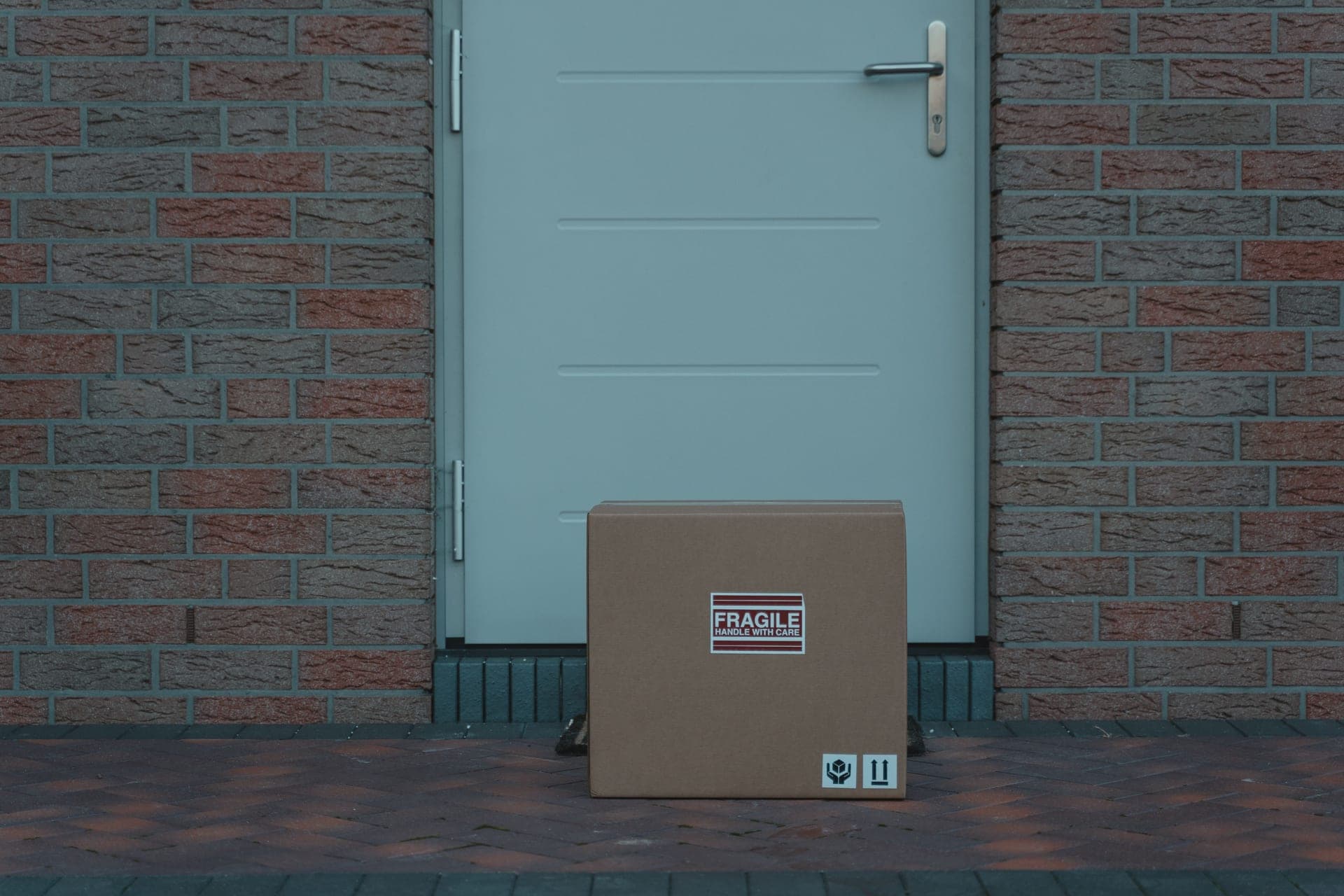 A cardboard subscription box on a doorstep