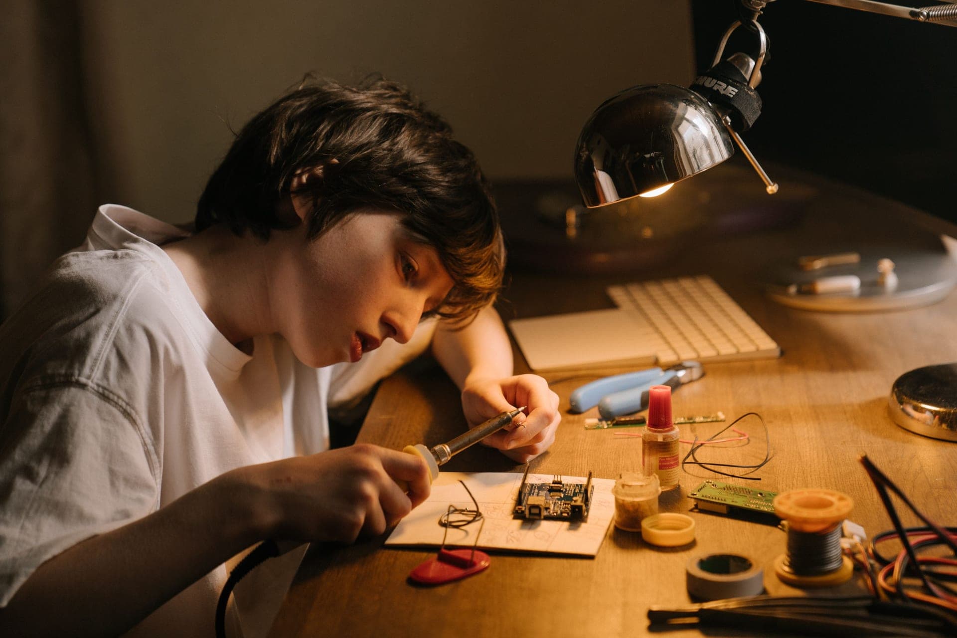 A child assembling a snap-together electronic circuit