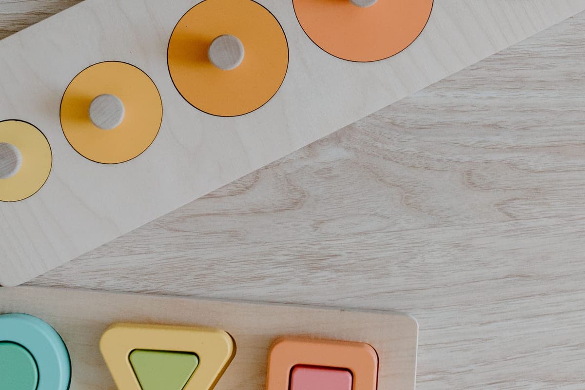 Colorful geometric puzzle pieces arranged on a table