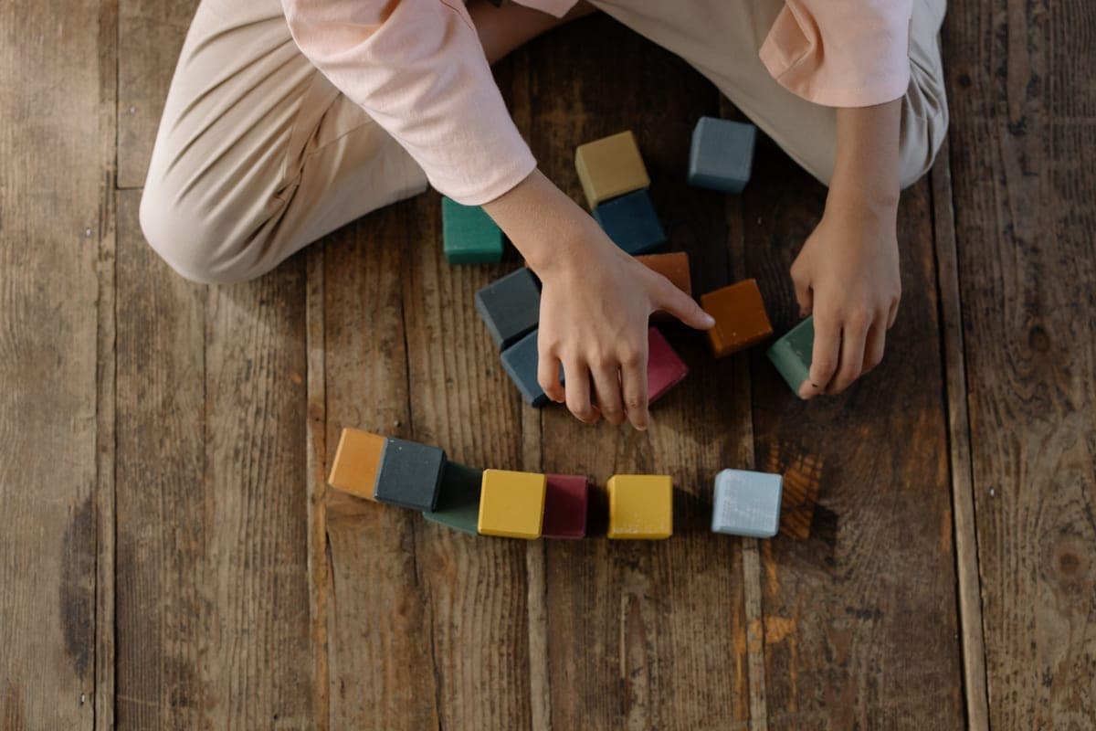A girl building with construction blocks