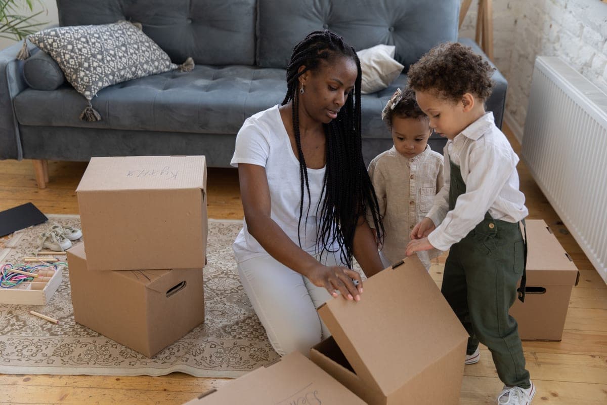 A parent reading a label on a toy box