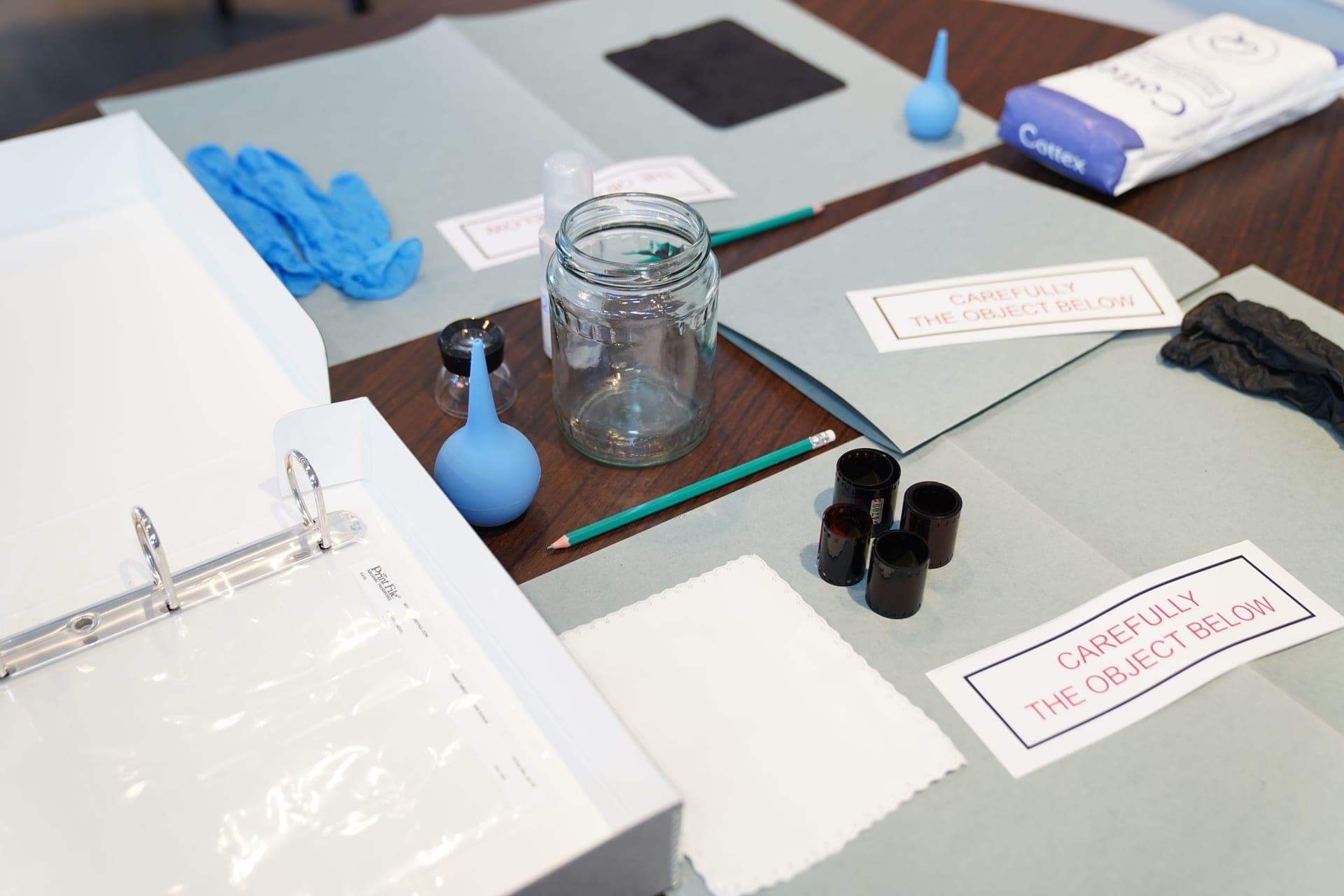 Science kit equipment laid out on a kitchen table