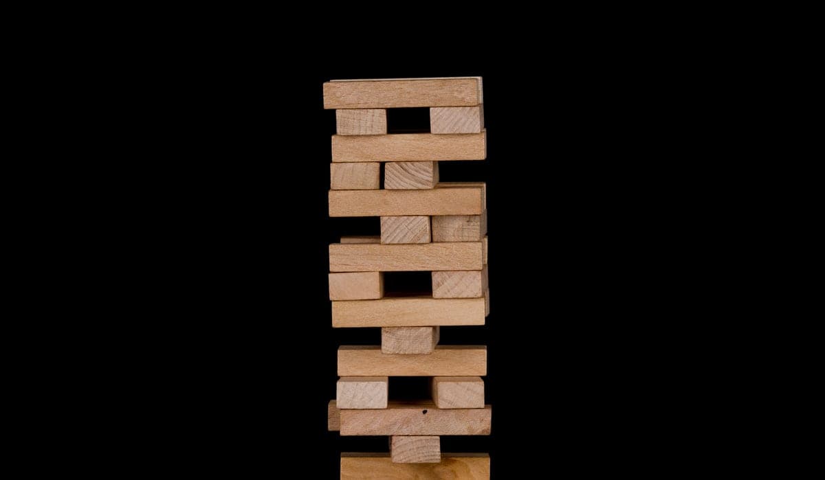 Wooden building blocks stacked into a tower