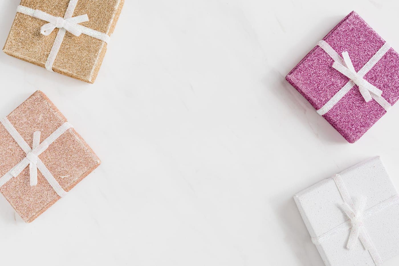 Wrapped pastel gift boxes arranged on a light surface