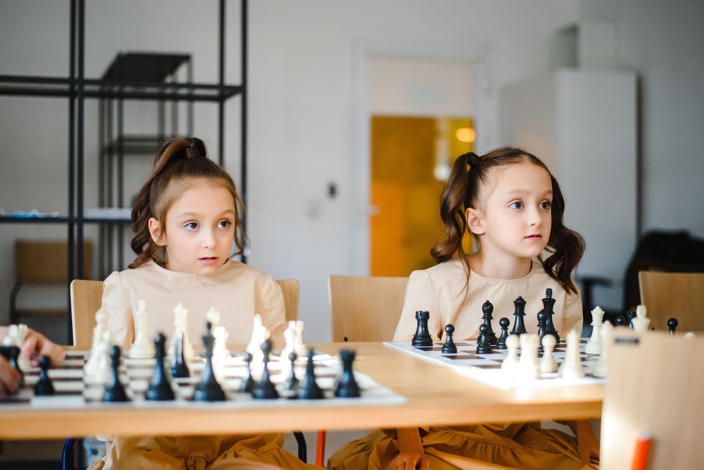 Children playing a logic puzzle board game